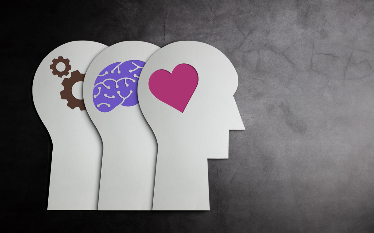 A visual metaphor for betting psychology, showing silhouettes of a head with gears, a brain, and a heart, representing logic, analysis, and emotion.
