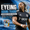 Adama Traoré in Coventry City kit celebrating on the football field, targeting Premier League stay.