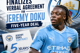 Jeremy Doku in Manchester City jersey during a press conference signing a five-year contract.