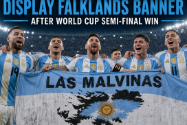 Argentina soccer players celebrate their World Cup semi-final win, holding a banner referencing the Falklands.