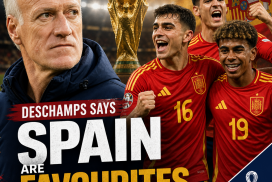 Portrait of Didier Deschamps speaking at a press conference about Spain as World Cup semi-final favorites.