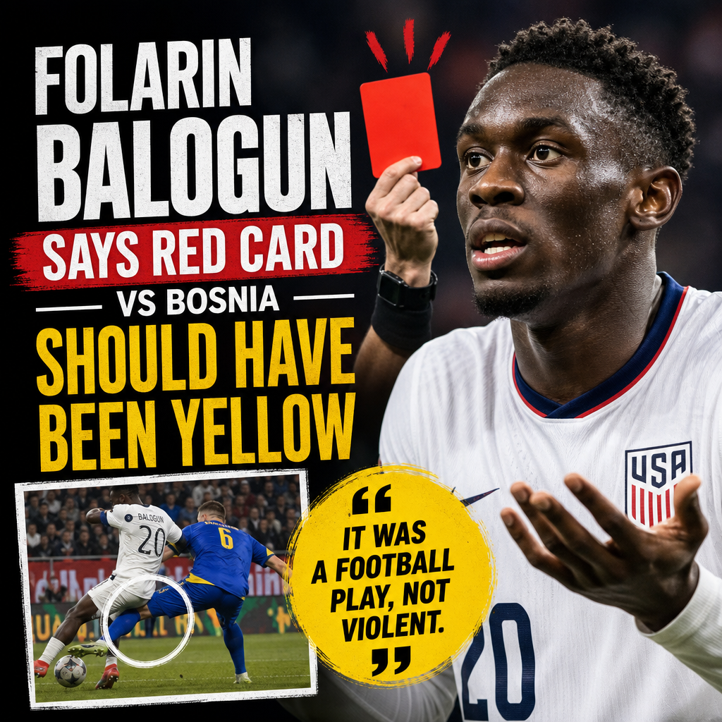 Folarin Balogun gestures passionately during a football match, disputing a red card decision.