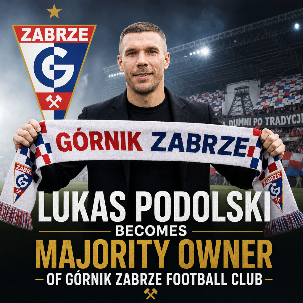 Lukas Podolski smiling, wearing a blue suit and white shirt, at a press event announcing ownership of Górnik Zabrze.