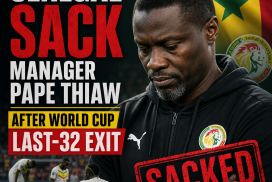 Senegal football manager Pape Thiaw seated at a press conference after World Cup last-32 exit.