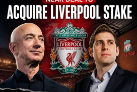 Jeff Bezos and Eduardo Saverin smiling and shaking hands, discussing Liverpool Football Club acquisition deal.