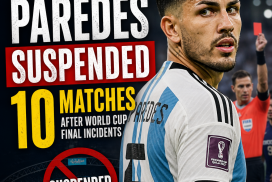 Leandro Paredes in Argentina jersey, holding a microphone during a press conference.