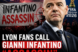Lyon football fans holding signs protesting FIFA president Gianni Infantino, calling him "assassin."