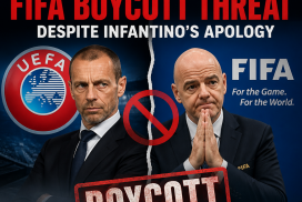 Prominent UEFA and FIFA football officials sit together during a press conference amid boycott talks.