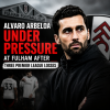 Alvaro Arbeloa in a white Fulham kit, under pressure from opponents during a Premier League match.