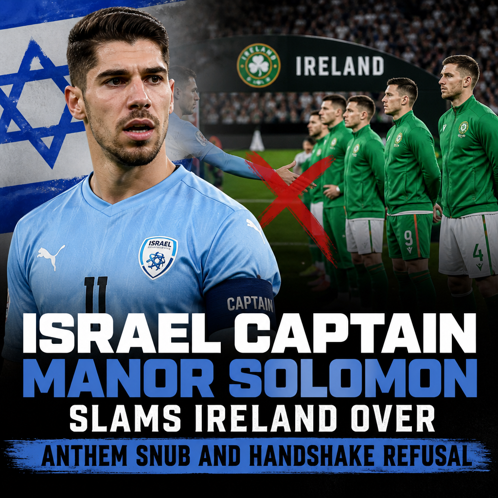 Israel football captain Manor Solomon in team jersey on the field speaking during a match.