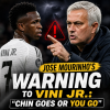 Jose Mourinho pointing and speaking firmly to Vini Jr. with a serious expression during a football match.