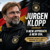 Jurgen Klopp smiling confidently in a suit, symbolizing his new role as Germany's national football team manager.