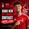 Neco Williams signing a new contract with Nottingham Forest, smiling and holding a signed document.