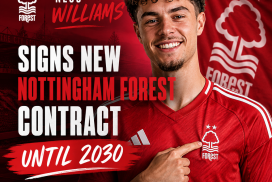 Neco Williams signing a new contract with Nottingham Forest, smiling and holding a signed document.