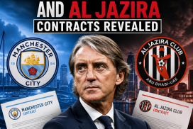 Photo of Roberto Mancini smiling during a press event, with Manchester City and Al Jazira logos in the background.