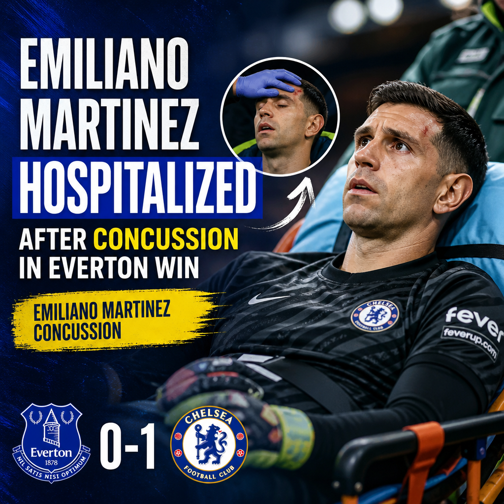 Chelsea goalkeeper Emiliano Martinez being helped off the field after a concussion during a match against Everton.