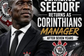 Clarence Seedorf smiling in a suit with Corinthians logo, announcing his return as manager after seven years.