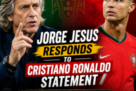 Jorge Jesus speaking at a press conference, wearing glasses and a navy blue shirt.