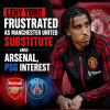 Leny Yoro looks frustrated sitting on the bench wearing Manchester United gear during a match.