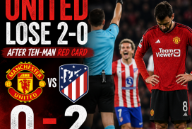 Manchester United player reacts in frustration as Atletico Madrid scores during a tense soccer match.