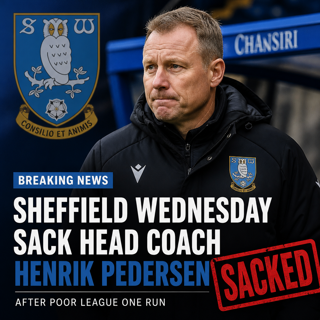 Sheffield Wednesday players and staff on the sidelines during a League One match.